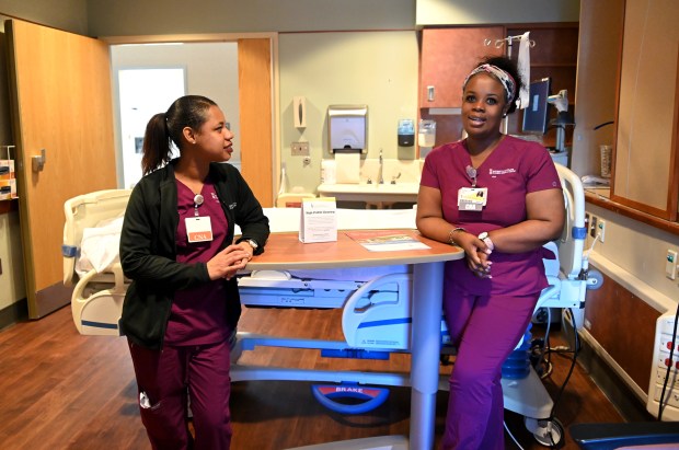 Danielle Gonzalez, left, and Alicia Saunders are CCBC students and participants in the Public Health Pathways program, which provides a group of CCBC nursing students with guaranteed education and employment at the University of Maryland St.  Joseph Medical Center after graduation.  (Lloyd Fox/Staff)